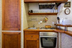 Kuchyň nebo kuchyňský kout v ubytování Guest House Flores
