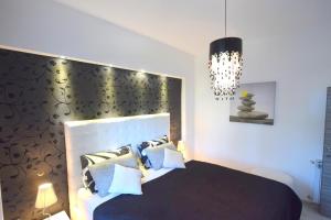 Postel nebo postele na pokoji v ubytování Apartments Antonija