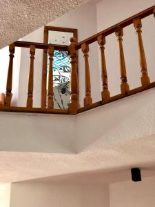 a stair railing with a clock on top of it at Kekova Hotel in Kaş