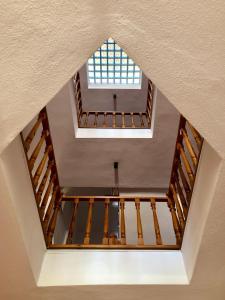 an attic view of a building with a window at Kekova Hotel in Kaş