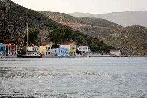 a town on the shore of a body of water at Kekova Hotel in Kaş