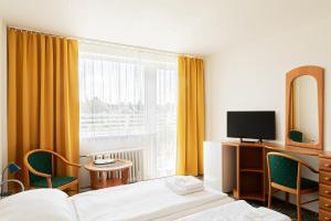 TV a/nebo společenská místnost v ubytování Hotel Slezan