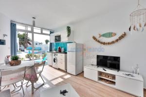 A kitchen or kitchenette at Vivienda Vacacional 1 Residence Los Delfines Blue Lagoon