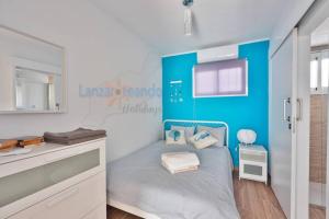 A bed or beds in a room at Vivienda Vacacional 1 Residence Los Delfines Blue Lagoon Még 23 kép
