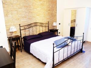 Posteľ alebo postele v izbe v ubytovaní R&B Locanda Le Bighe + 27 fotografií