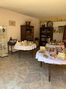 a room with two tables with food items on them at Casa Julie in Patrimonio