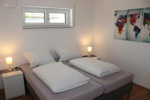 Postel nebo postele na pokoji v ubytování Ferienwohnung Zum Hohlenstein