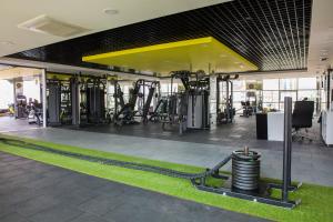 a gym with lots of exercise equipment in a building at Hotel BFC Spa & Sport in Bursa
