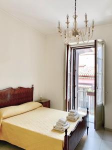 Posteľ alebo postele v izbe v ubytovaní Old Catania Terrace