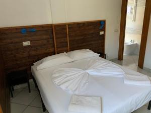 Postel nebo postele na pokoji v ubytování B&B Gli Archi