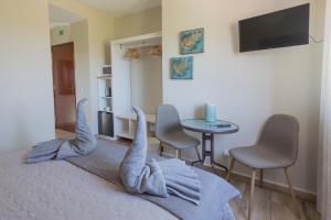 a bedroom with a bed with a whale headboard at Casa da Falfeira B&B in Lagos