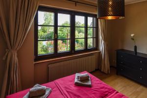 Postel nebo postele na pokoji v ubytování Doppelhaus Villa Casa Alpe Adria