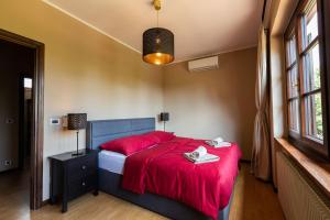 Postel nebo postele na pokoji v ubytování Doppelhaus Villa Casa Alpe Adria