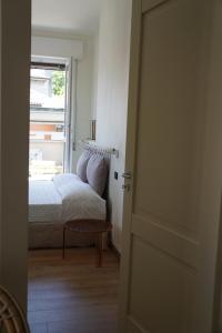 A bed or beds in a room at La Rotonda 2 Camere con terrazza in centro