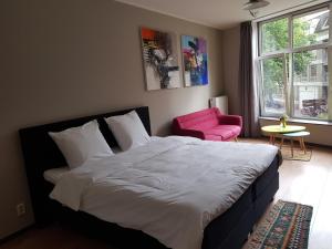 Postel nebo postele na pokoji v ubytování HOLT Hotel