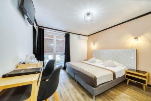 Postel nebo postele na pokoji v ubytování Sud Hôtel