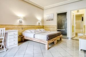 Postel nebo postele na pokoji v ubytování Sud Hôtel