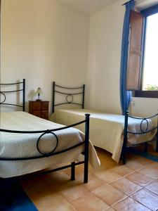Posteľ alebo postele v izbe v ubytovaní Villa Viuccio