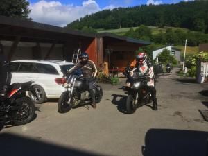 a group of people riding motorcycles in a parking lot at Hotel Hoxter Am Jakobsweg in Höxter