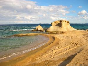 a rock formation on a beach near the ocean at Villa Evgenia(Leonidas) in Ierissos