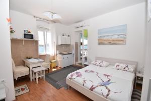 Кровать или кровати в номере Apartmani Rina