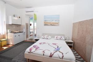 Кровать или кровати в номере Apartmani Rina