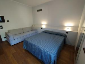 Postel nebo postele na pokoji v ubytování Albergo Ristorante Orazio