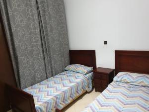 Voodi või voodid majutusasutuse Résidence EL AMAL toas