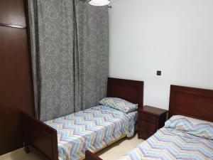 Voodi või voodid majutusasutuse Résidence EL AMAL toas