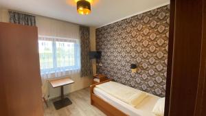 Postel nebo postele na pokoji v ubytování Schröder's Motel