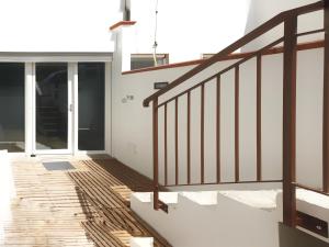 a staircase leading to a house with glass doors at Via Mare in Ginosa Marina