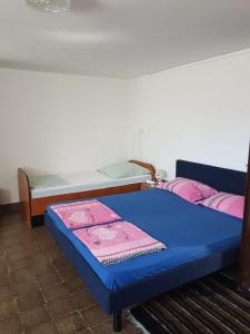 a room with two beds and a blue mattress at APP-AMELIJAS in Zambratija