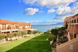 a view from the balcony of a villa with a lawn at Appartamento in Costa Smeralda - Bilocale sul mare - Sea View in Olbia