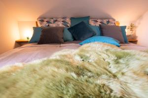 מיטה או מיטות בחדר ב-VILLA zeitlos - PfauenAuge