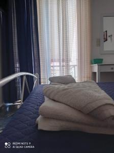 Кровать или кровати в номере Nancy Rooms