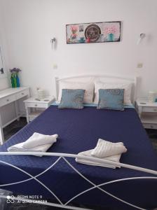 Кровать или кровати в номере Nancy Rooms