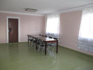 a room with a table and chairs in it at Rubeni in Pilskalne +22 photos