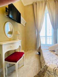 TV a/nebo společenská místnost v ubytování Boutique Hotel Calais Milano