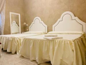 Postel nebo postele na pokoji v ubytování Boutique Hotel Calais Milano