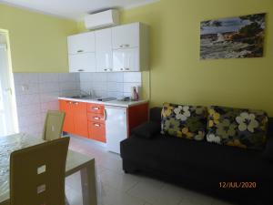 Kuchyň nebo kuchyňský kout v ubytování Apartments ORSIC