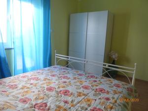 Postel nebo postele na pokoji v ubytování Apartments ORSIC