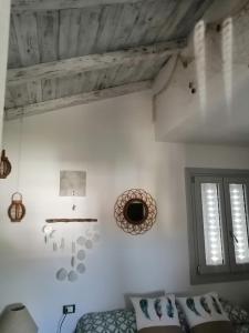 A bed or beds in a room at Oltre le Dune