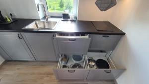 a kitchen with a sink and a counter at Villa Monciske in Palanga