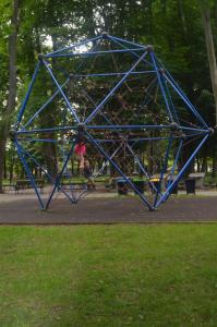 a blue play structure in a park at Dom na Mazurach in Ostróda