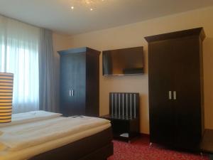 Postel nebo postele na pokoji v ubytování Top Hotel Krämer