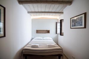 A bed or beds in a room at Charming Trulli