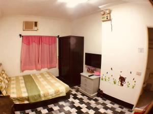 Cama o camas de una habitación en Kenting Airport Homestay 機場民宿