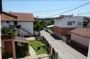 an empty street in a town with houses at Apartments Due Mondi in Vrnjačka Banja