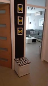 a room with a door with batman pictures on it at Apartment Vukovarska in Zadar