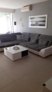 a living room with a couch and a coffee table at Apartment Vukovarska in Zadar